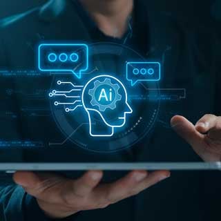 A person holds a digital tablet displaying a glowing holographic interface with an AI (artificial intelligence) icon, speech bubbles, and gear symbols, representing the relevance of technology in higher education.