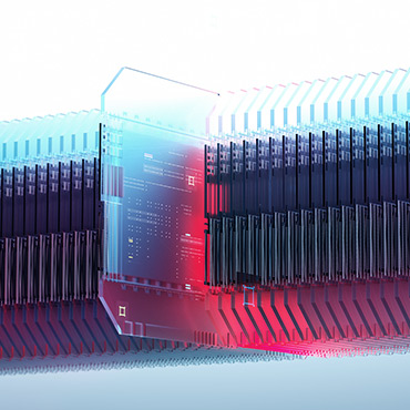 one computer chip pulled out from a stack