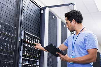 cyber security analyst in server room