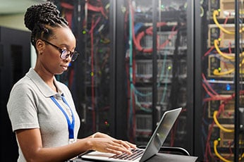 photo of woman working at a laptop