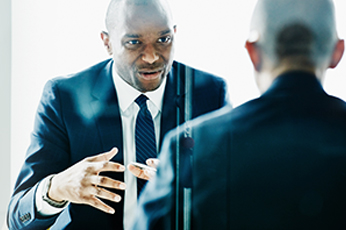 two male professionals in a meeting
