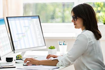 Woman working on a computer.