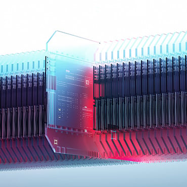 one computer chip pulled out from a stack