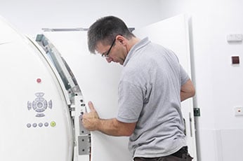 A specialist in medical technology assembling a medical device