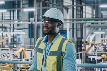 A technician performing maintenance, installation and testing on various machines